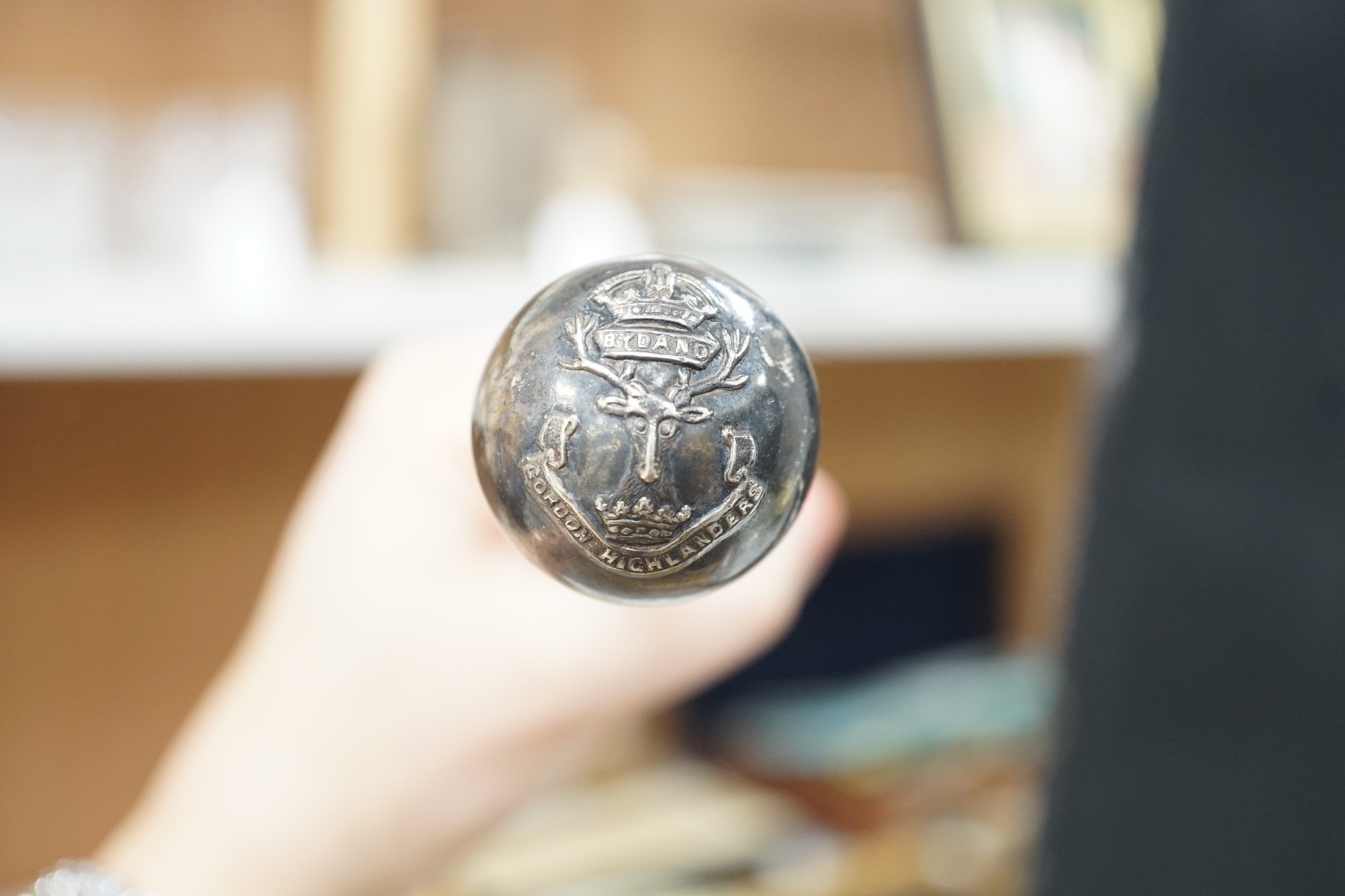 A Royal Doulton series ware bowl, a ship in a bottle and a Gordon Highlanders white metal mounted swagger stick